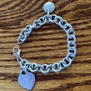 Tiffany & Co. Silver Heart Tag Charm Bracelet with an “E” on a charm